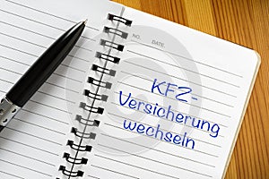 Note in german language: KFZ -Versicherung wechseln photo
